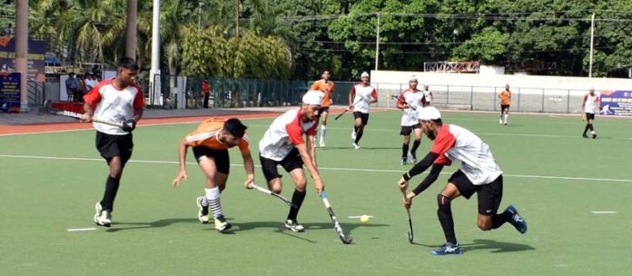 Players in action during a semi-final match of Hockey J&K UT Men Championship at KK Hakku Hockey Stadium, Jammu.