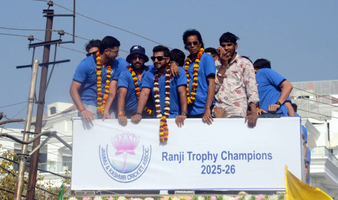 J&K Ranji team rides an open bus during victory march in Jammu on Sunday. -Excelsior/Rakesh