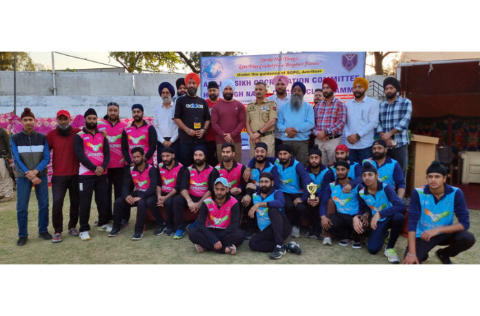 Players along with dignitaries posing for a photograph during a programme at Jammu.