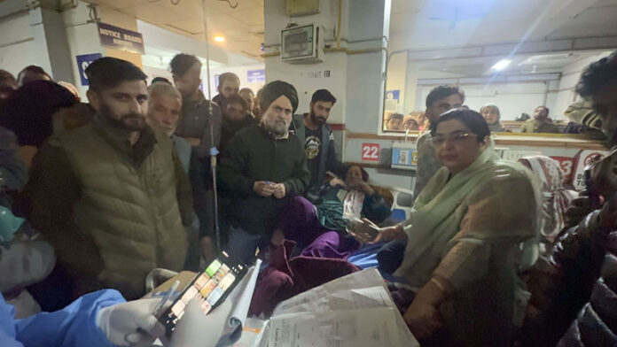 Patients protesting at GMC Anantnag alleging that expired saline was adminstered at the hospital. — Excelsior/Sajad Dar