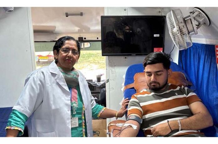 A student donating blood during a camp by GCET Jammu. A student donating blood during a camp by GCET Jammu.