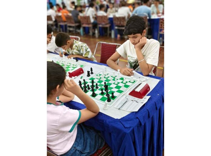 Young participants engrossed in action during the International Rating Chess Fiesta at IDPS Jammu.