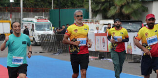 Ace runner and actor Milind Soman running during the Jammu Marathon on Sunday.