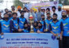 Winning tem posing along with dignitaries.