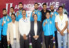 Medal winners posing along with dignitaries.