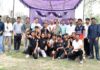Winning team posing along with dignitaries.