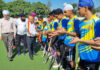 Dignitary interacting with players before start of match.
