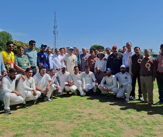 Cricket teams posing along with dignitaries during the event.