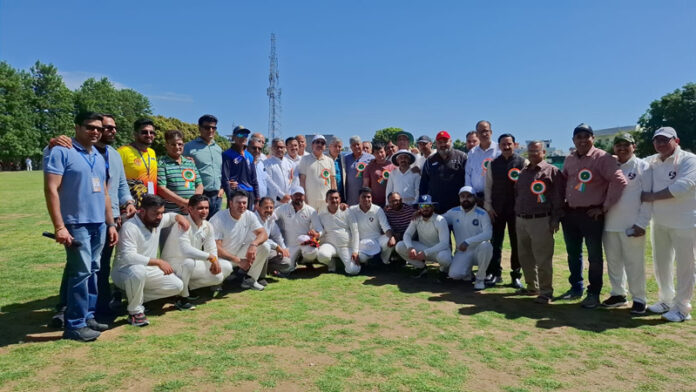 Cricket teams posing along with dignitaries during the event.