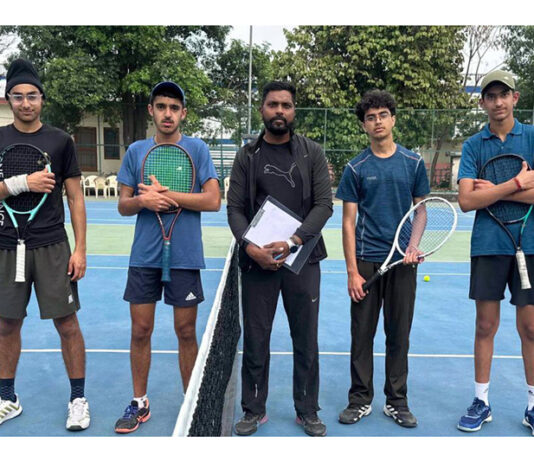 Tennis players posing before start of match at MA Stadium Jammu.