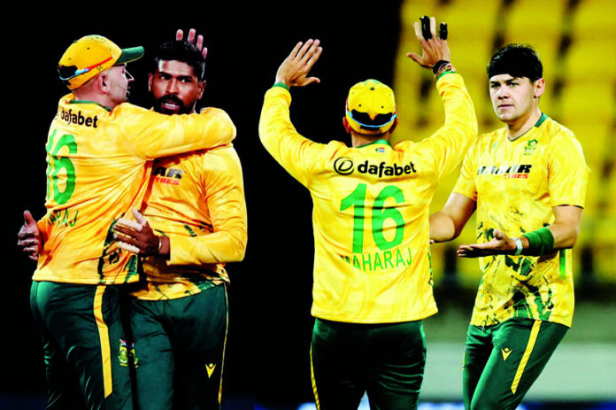 South African players celebrating victory after defeating New Zeland by 19 runs at Wellington on Sunday.