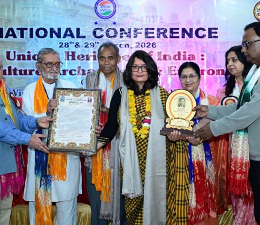Dignitaries giving Dr. S.R Verma Memorial Award to Dr. Sonia Jasrotia during an event at Gwalior in Madhya Pradesh.