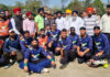 Players posing along with dignitaries.