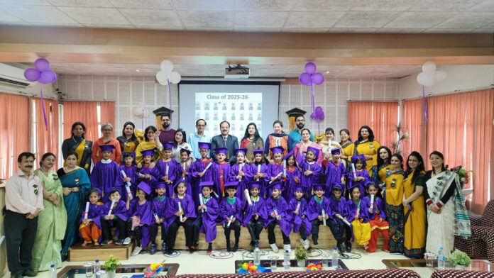Students posing along with dignitaries during a programme.