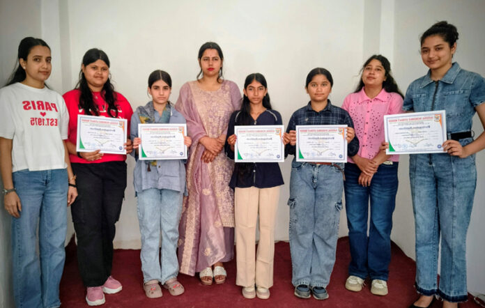 Winners posing along with certificates.