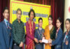 Students of Dogra Higher Secondary School presenting cheque to representatives of Zila Sainik Board.