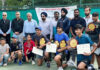 Champions and participants posing for a group photograph with JKLTA officials at MA Stadium Jammu.