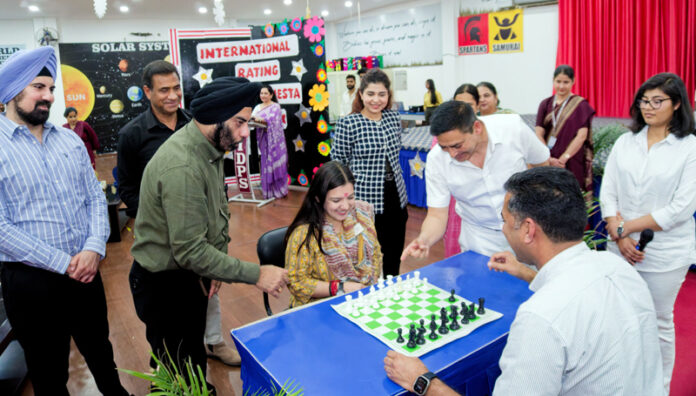 MLA Nagrota Devyani Rana making the first move at International Rating Chess Fiesta.