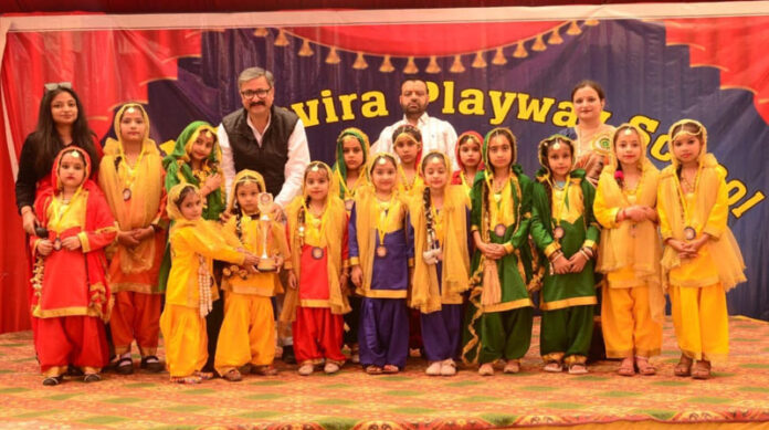 Young students posing along with dignitary.