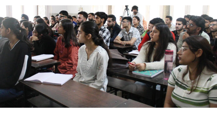 The student of SR College interacting with the JKAS Topper Absyu Sharma in Jammu.