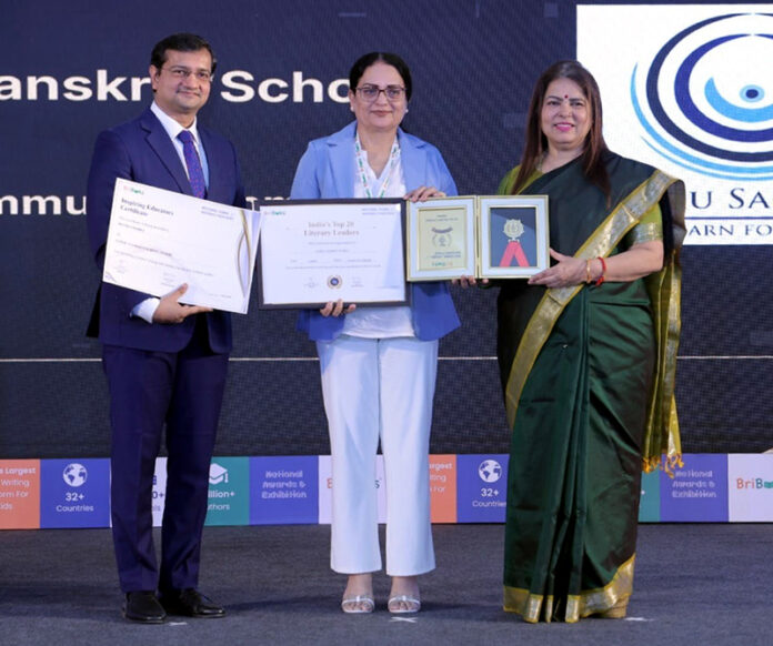Jammu Sanskriti School representative receiving award during a programme.
