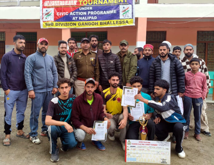 Winning team posing along with certificates and trophy. -Excelsior/Tilk Raj