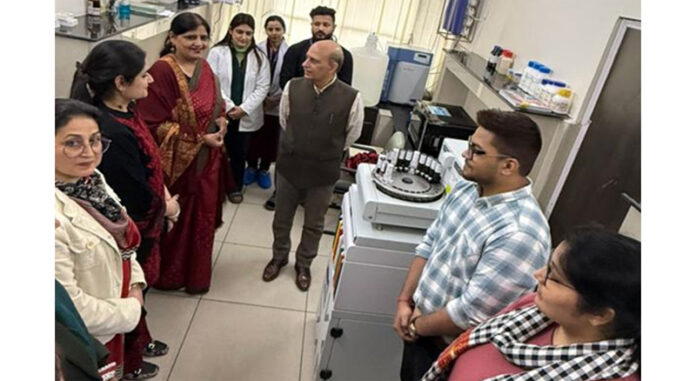 Principal GMC Jammu Dr Ashutosh Gupta interacting with staff at advanced molecular testing facility of the Institution.