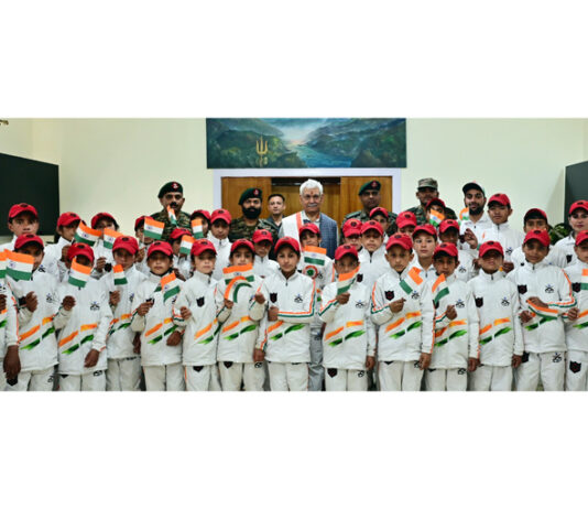 LG Manoj Sinha posing with the students from Army Goodwill School, Saujiyan at Lok Bhawan.
