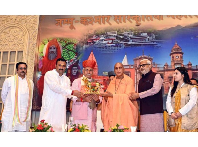LG Manoj Sinha, Swami Avdheshanand Giri Ji Maharaj and other dignitaries during a Cultural Festival at Jammu on Tuesday.