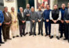 Trustees of Dharmarth Trust posing along with others in Jammu.