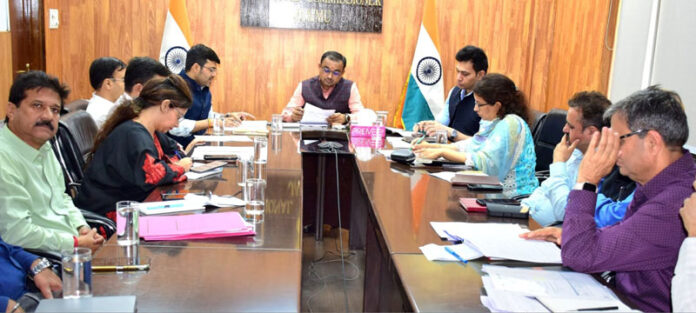 Div Com chairing a meeting on Tuesday.