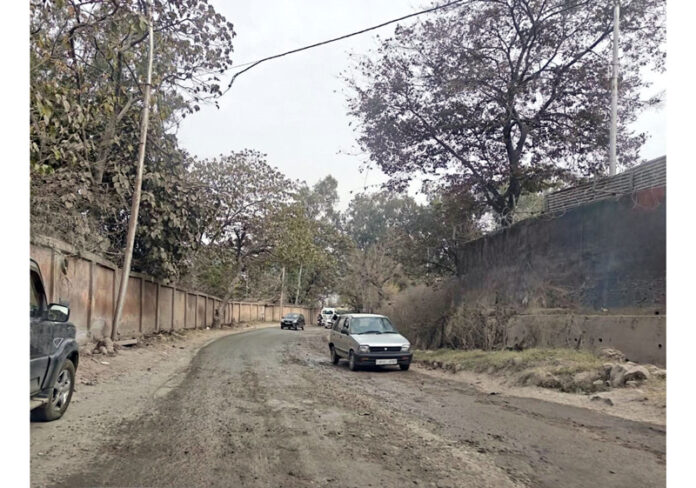 Broken surface of the National Highway stretch, near BSF Gate in Rajouri town, causing inconvenience to general public. -Excelsior/Imran