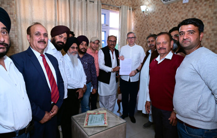 Chief Minister meeting a delegation at Jammu on Tuesday.