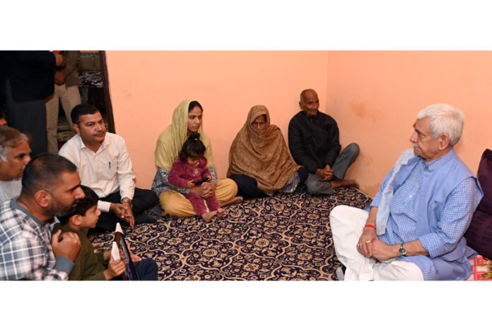 Lt Governor Manoj Sinha interacting with family members of SSF personnel , Sunny Salgotra.
