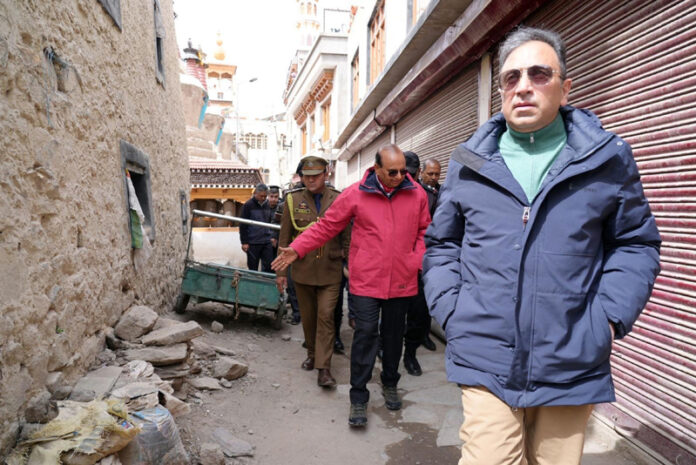 LG Ladakh VK Saxena passing through a narrow lane during his inspection visit to Leh old town.