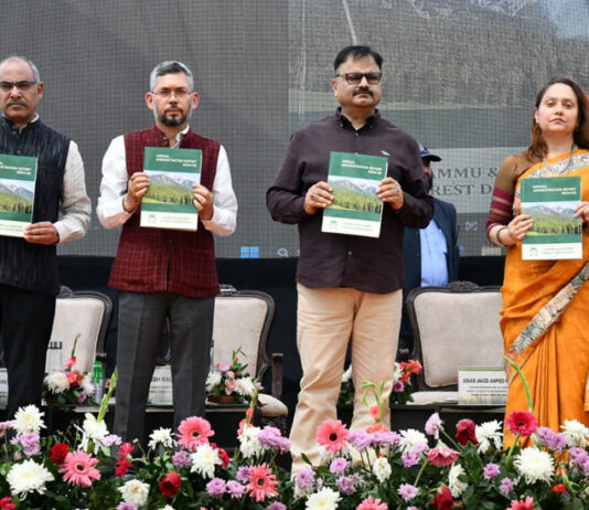 Forest Minister and officers during a function at Jammu on Tuesday.