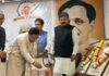 MP Sat Sharma lighting the ceremonial lamp during a function in Jammu.