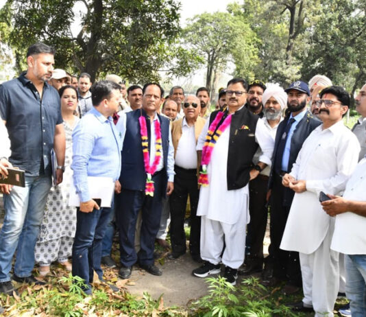 Minister Javed Rana inspecting desilting of canals on Saturday.