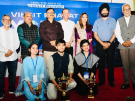 Minister Javed Rana posing for photograph with winners of J&K Viksit Bharat Youth Parliament on Wednesday.