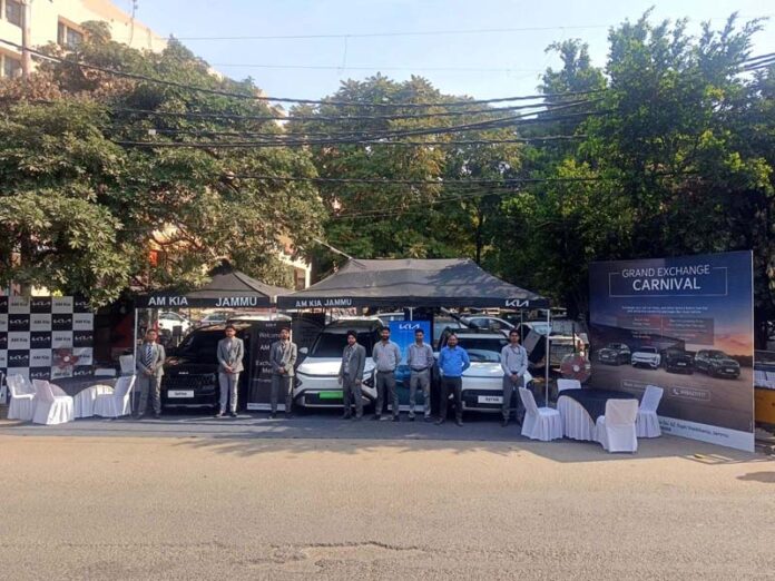 Dignitaries during the launch of Kia car exchange mela in Jammu on Friday.