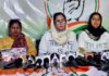J&K Pradesh Mahila Congress president Shameema Raina along with others during a press conference at Srinagar on Friday. -Excelsior/Shakeel