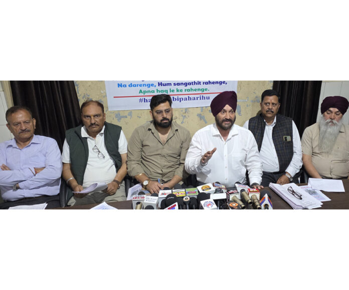 Members of Sangarsh Samiti addressing a press conference in Jammu. —Excelsior/Rakesh