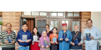 Prof Shiv Nirmohi and others releasing Sonika Sharma's book at Udhampur on Sunday.