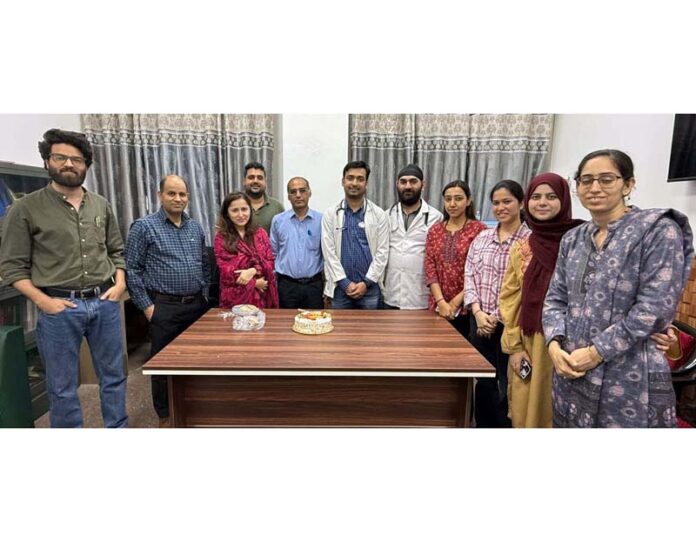 HoD Radiation Oncology at GMC Jammu, Dr Rahul Sharma and other faculty members posing with PG students.