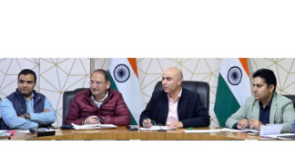 DC Kishtwar chairing a meeting on Sunday.