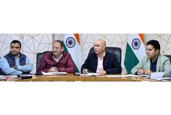 DC Kishtwar chairing a meeting on Sunday.