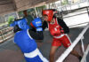 Boxers in action during Jammu District Boxing Championship match in Jammu.