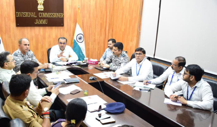 Divisional Commissioner chairing a meeting at Jammu on Thursday.