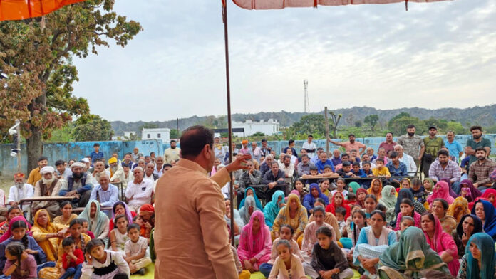 MLA Jasrota, Rajiv Jasrotia addressing a public gathering in Jasrota village on Tuesday.