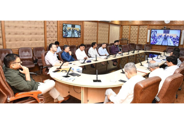 Minister Javed Rana chairing a meeting on Monday.